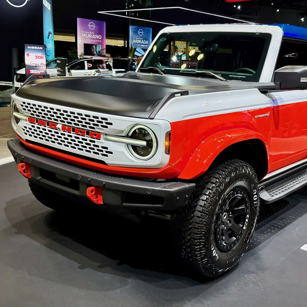 Front quarter of a red, white and blue 2025 Ford Bronco Stroppe Edition.