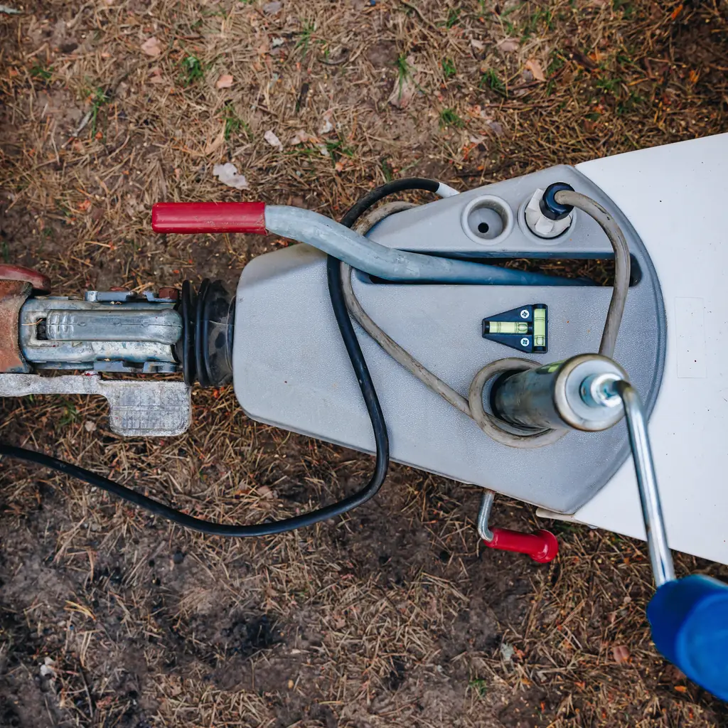 Overhead view of a trailer coupler and tow hitch.