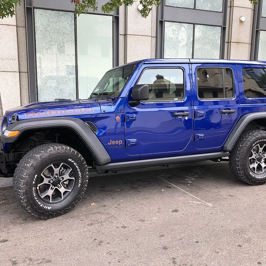 Blue Jeep Wrangler Rubicon fitted with a body-colored hardtop.