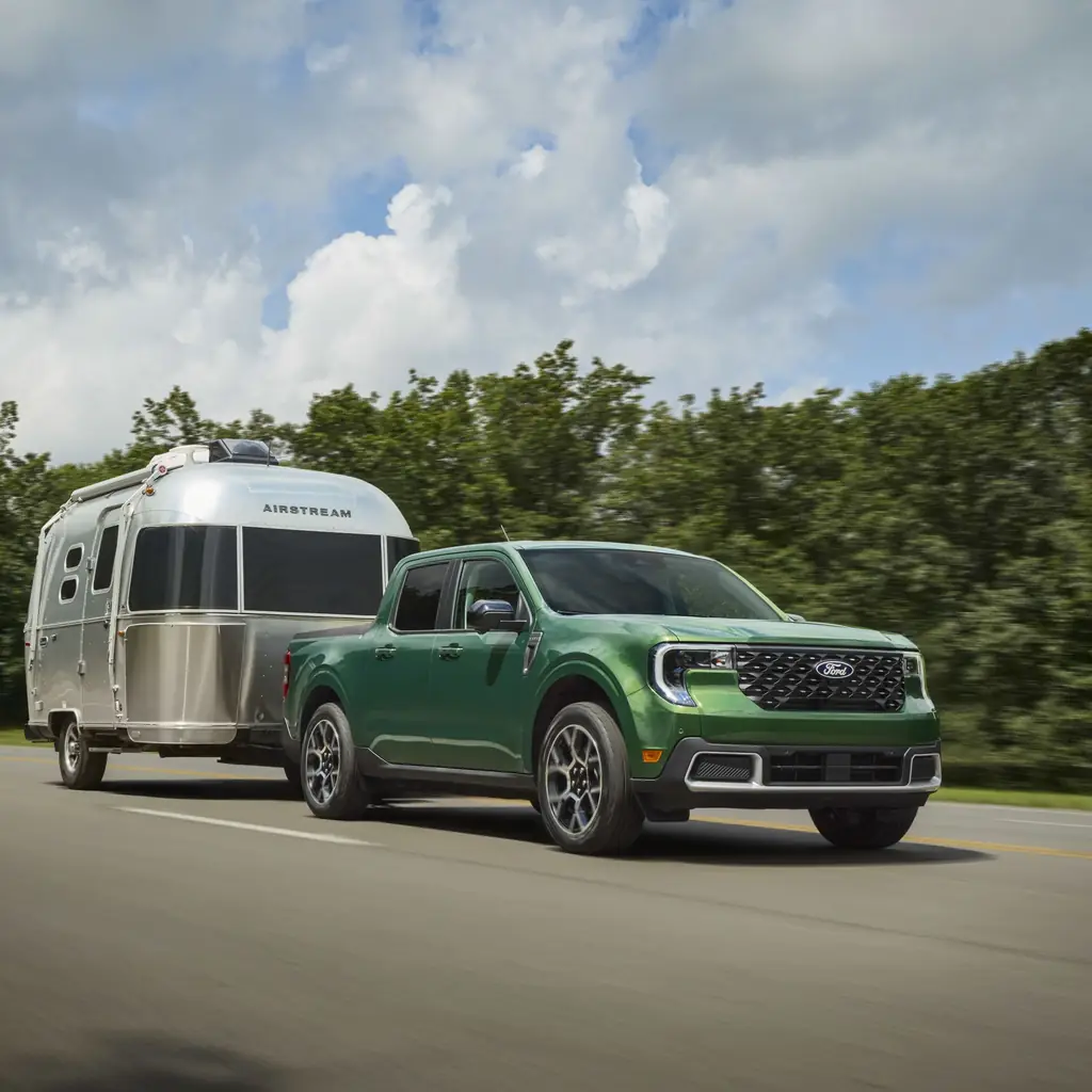 A Ford Maverick towing a travel trailer.