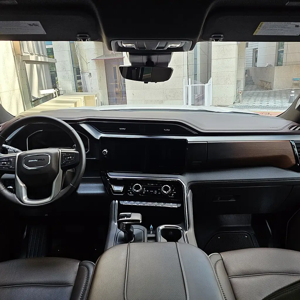The dashboard and central screen of a GMC Sierra Denali.