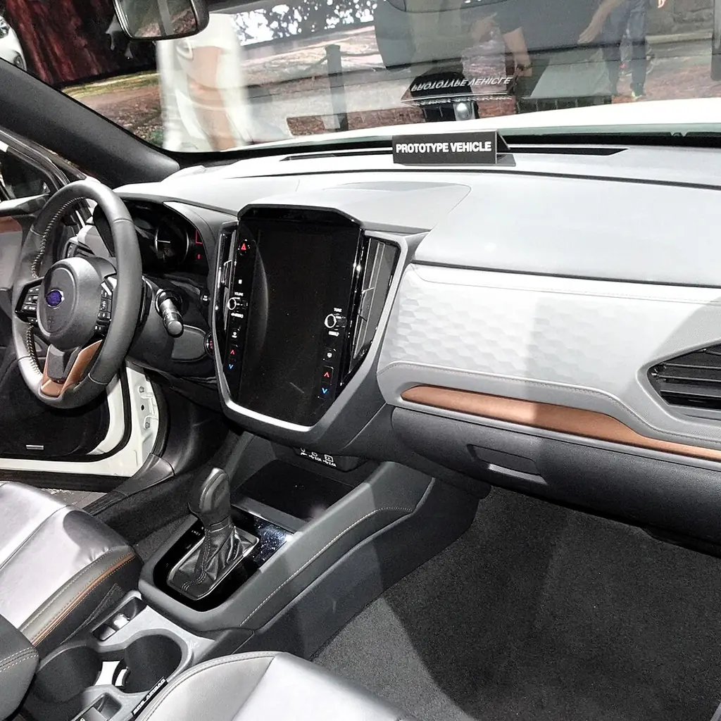 Dashboard, touchscreen and front passenger area of a 2025 Subaru Forester Sport.