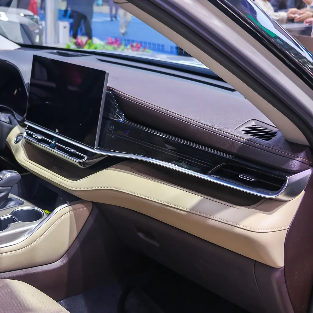 Large center touchscreen and passenger-side dashboard in a Toyota Highlander.