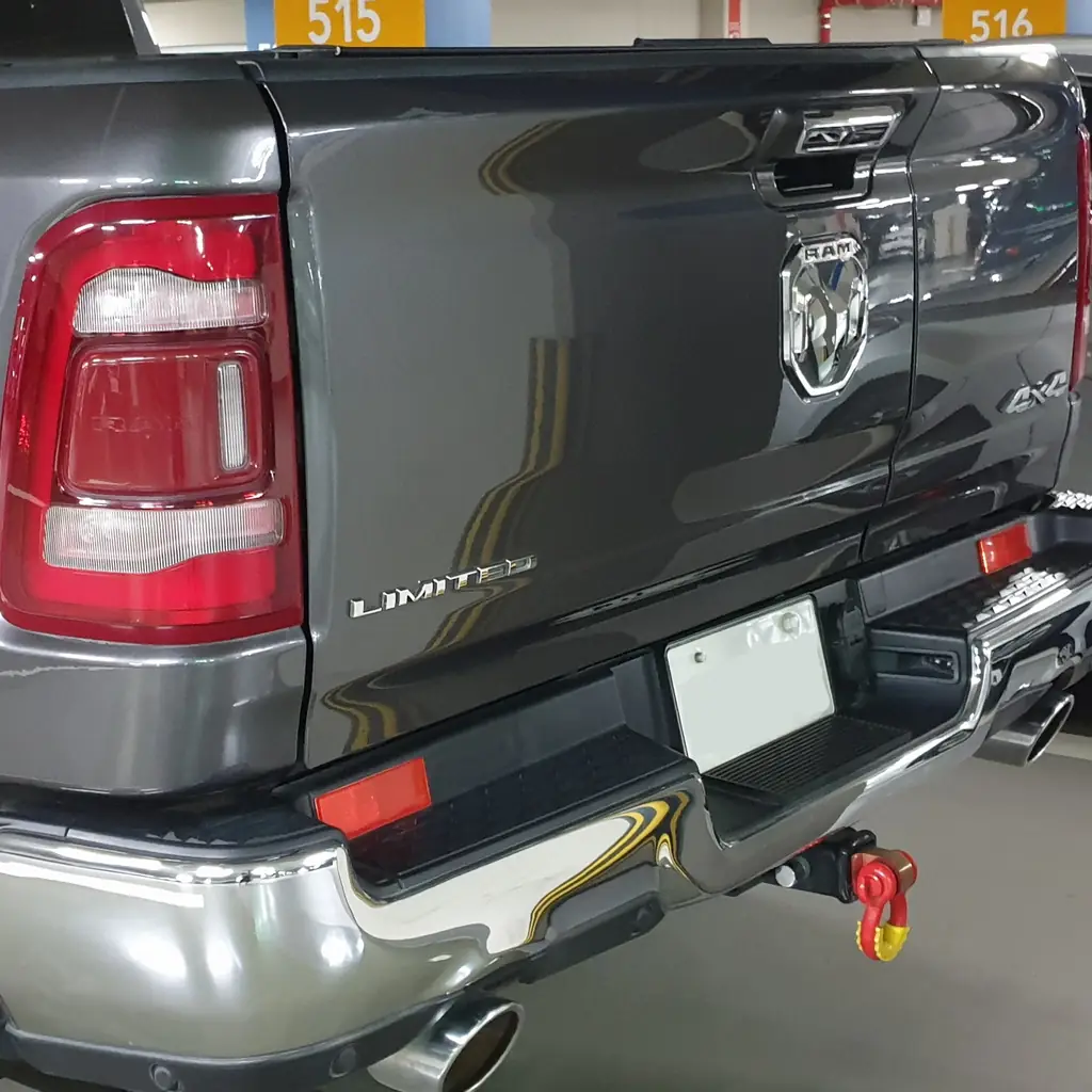 Closed conventional tailgate and rear bumper of a Ram 1500 Limited.