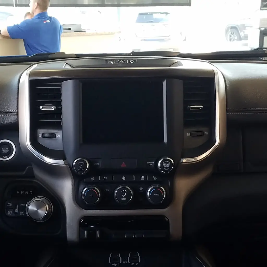 Center touchscreen and dashboard controls in a 2021 Ram 1500.