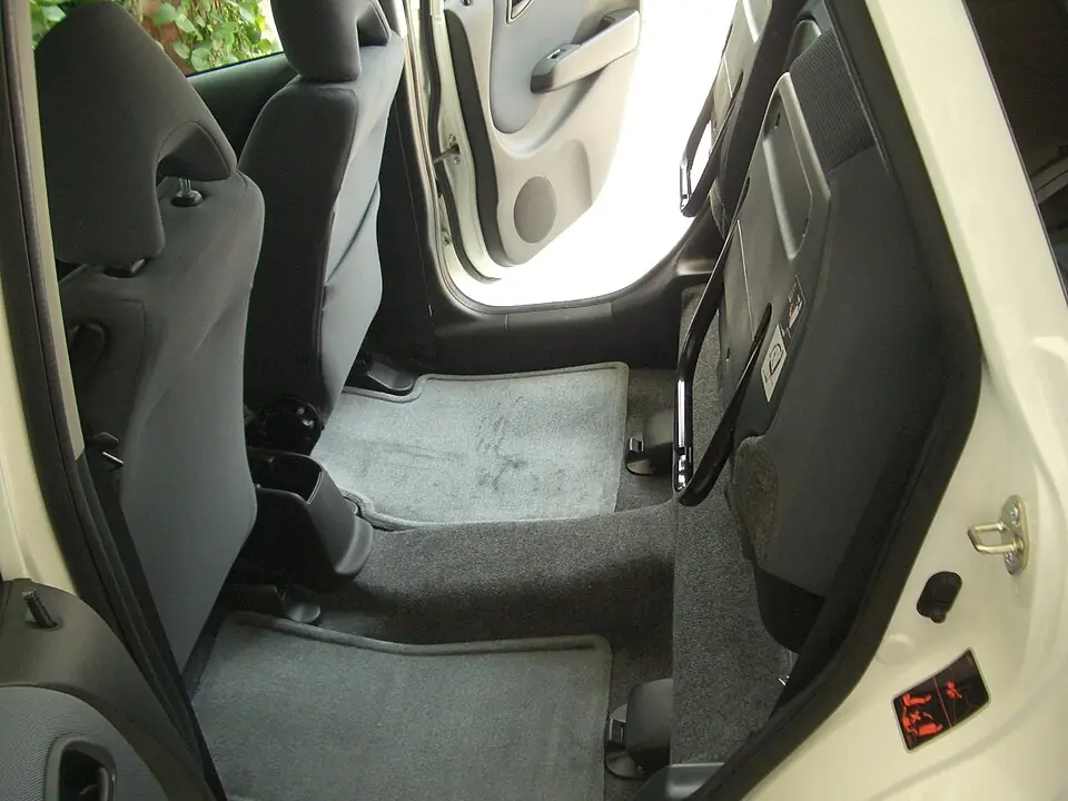 Honda Fit with its rear cushions raised for tall cargo